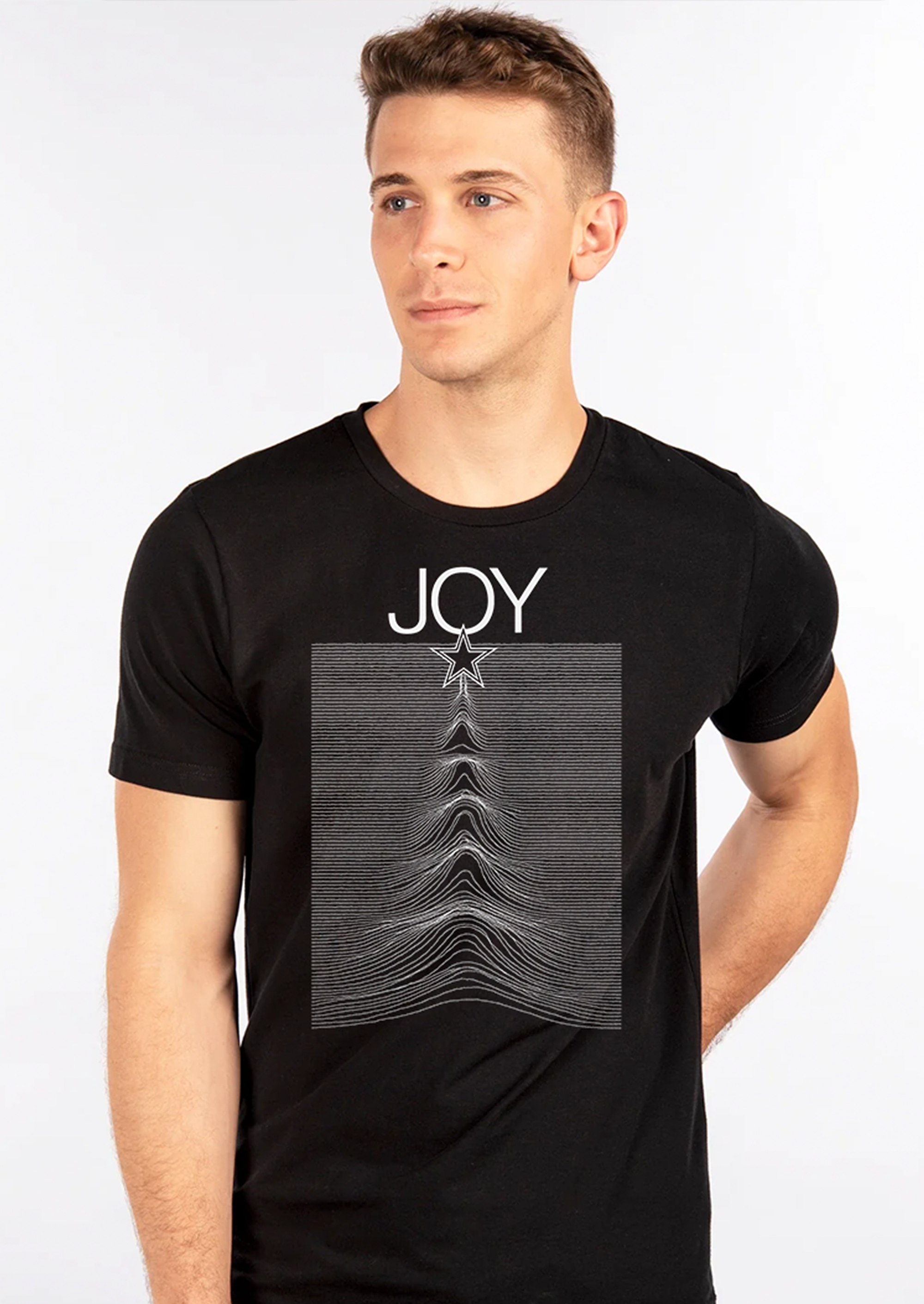 Man wearing a black JOY men’s t-shirt featuring a star and waveform graphic design, perfect for music and holiday style.