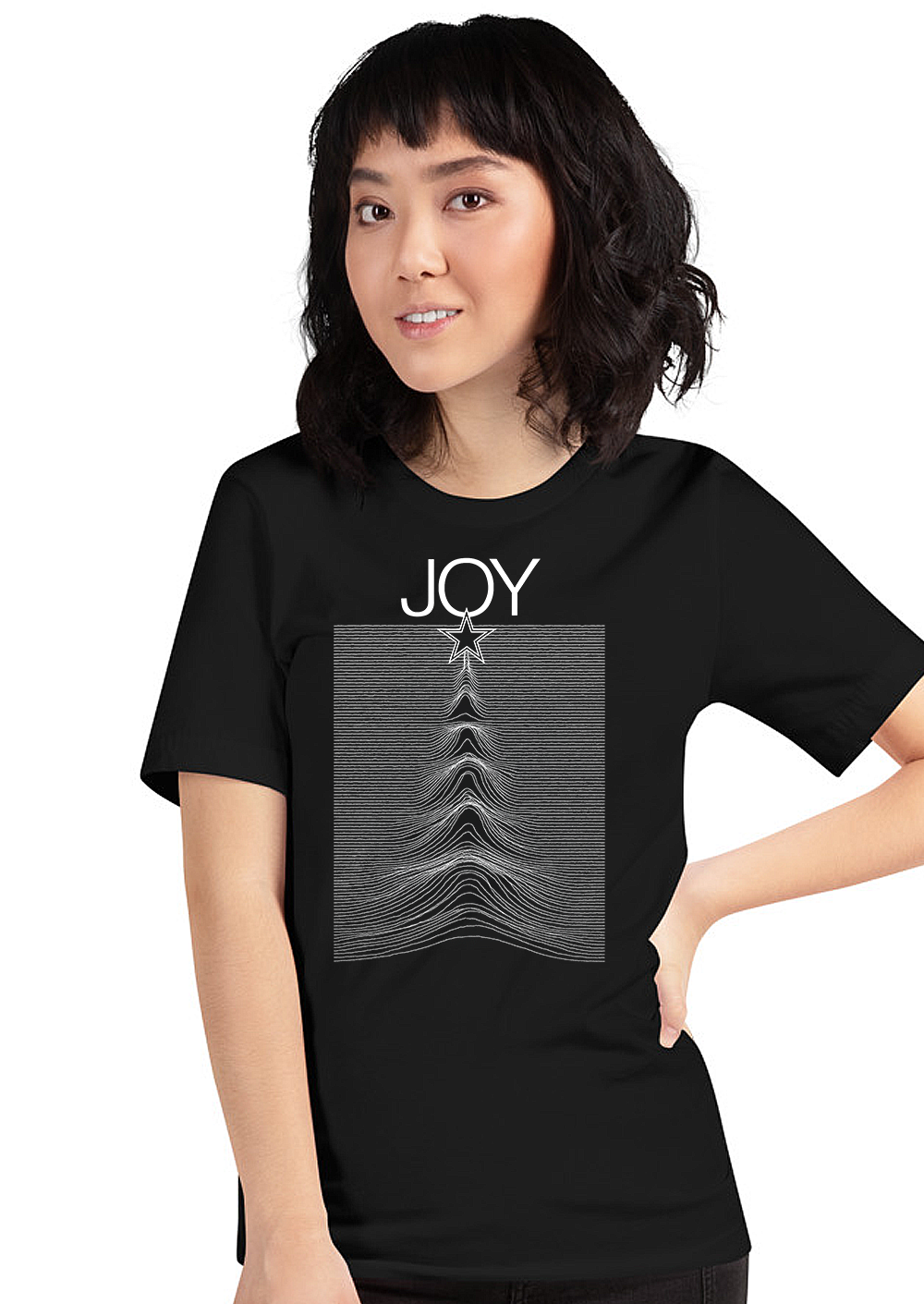 Woman wearing a black JOY women’s t-shirt featuring a star and waveform graphic design, perfect for music and holiday style.