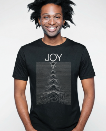 Man wearing a black JOY men’s t-shirt featuring a star and waveform graphic design, perfect for music and holiday style.